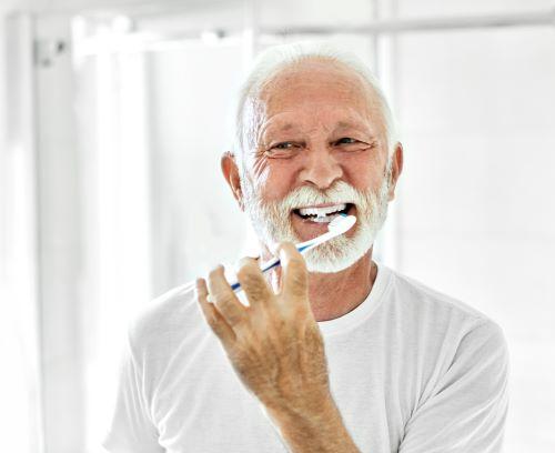 older man smiling | high point nc dentist