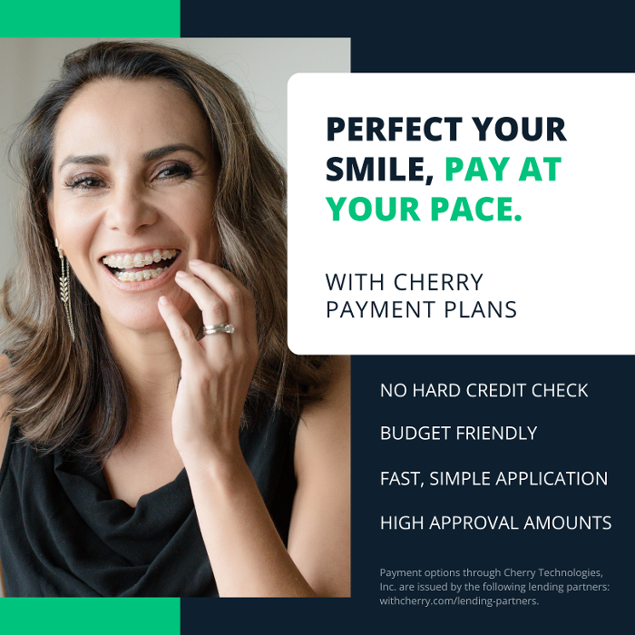woman with braces smiling | cosmetic dentist high point nc