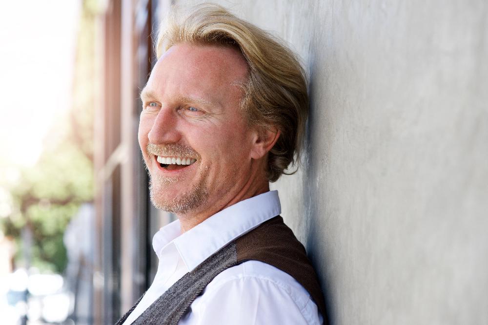 blonde man smiling outside | smile makeover high point nc
