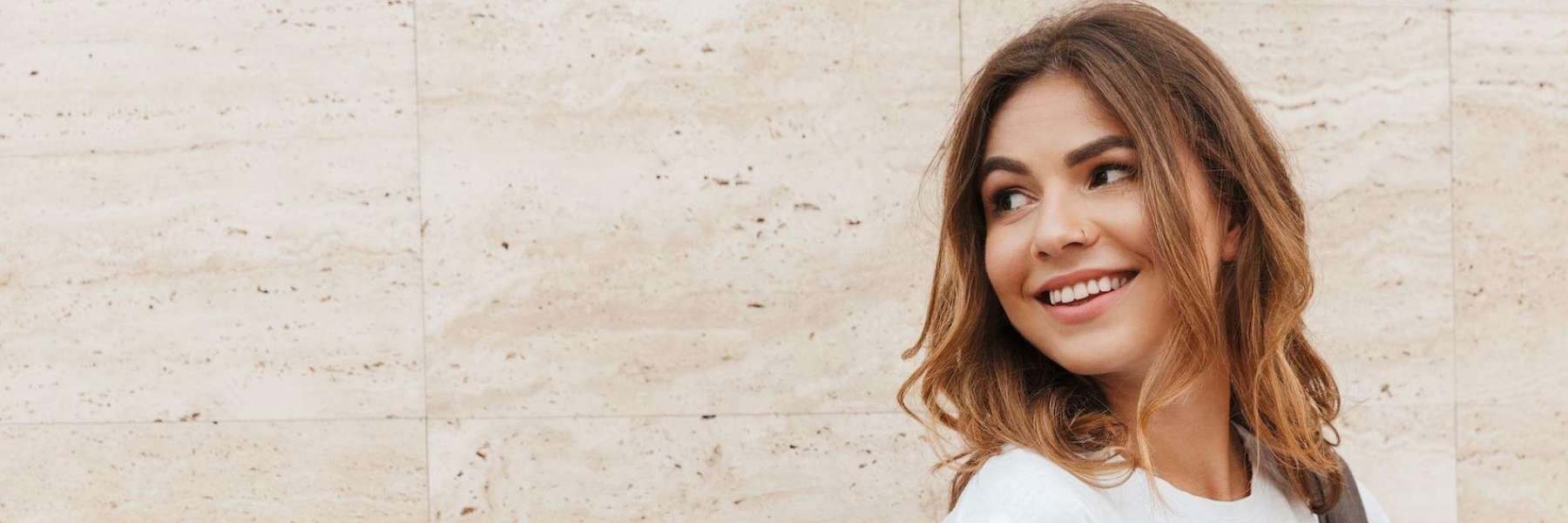 woman with brown hair walking | general dentist high point nc