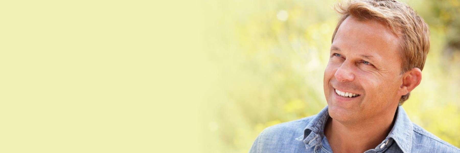 blonde main smiling outside | high point nc dentist